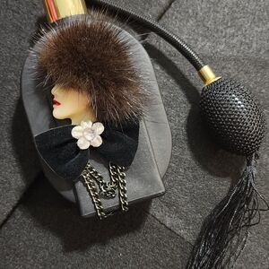 Elegant Black Perfume Bottle with Fur Accent
